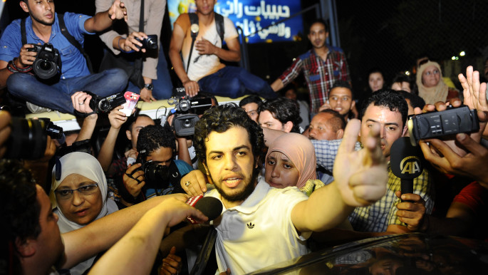 Al Jazeera's Egyptian journalist Abdullah Elshamy speaks to the media upon his release from jail in Cairo, Egypt on 17 June 2014. [Getty]
